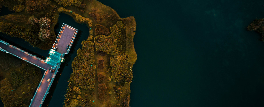 storage/images/posts//aerial-shot-dock-body-ocean-surrounded-by-island-trees1_1711324444.jpg